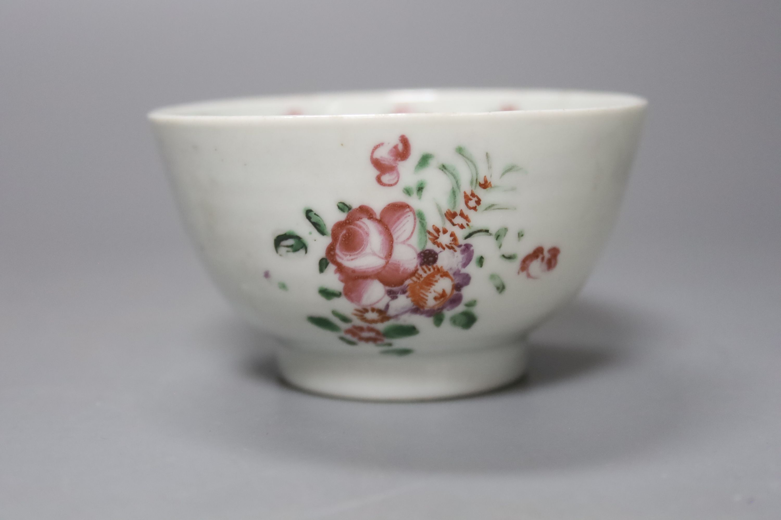 Two Chinese famille rose bowls together with a similar blue and white bowl, largest diameter 14cm